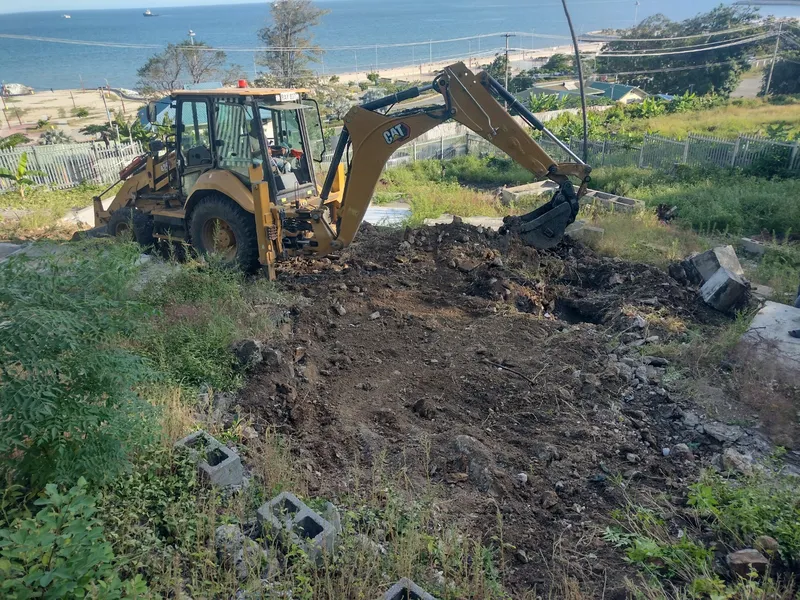 Engineer assessing slope stability on a hillside
